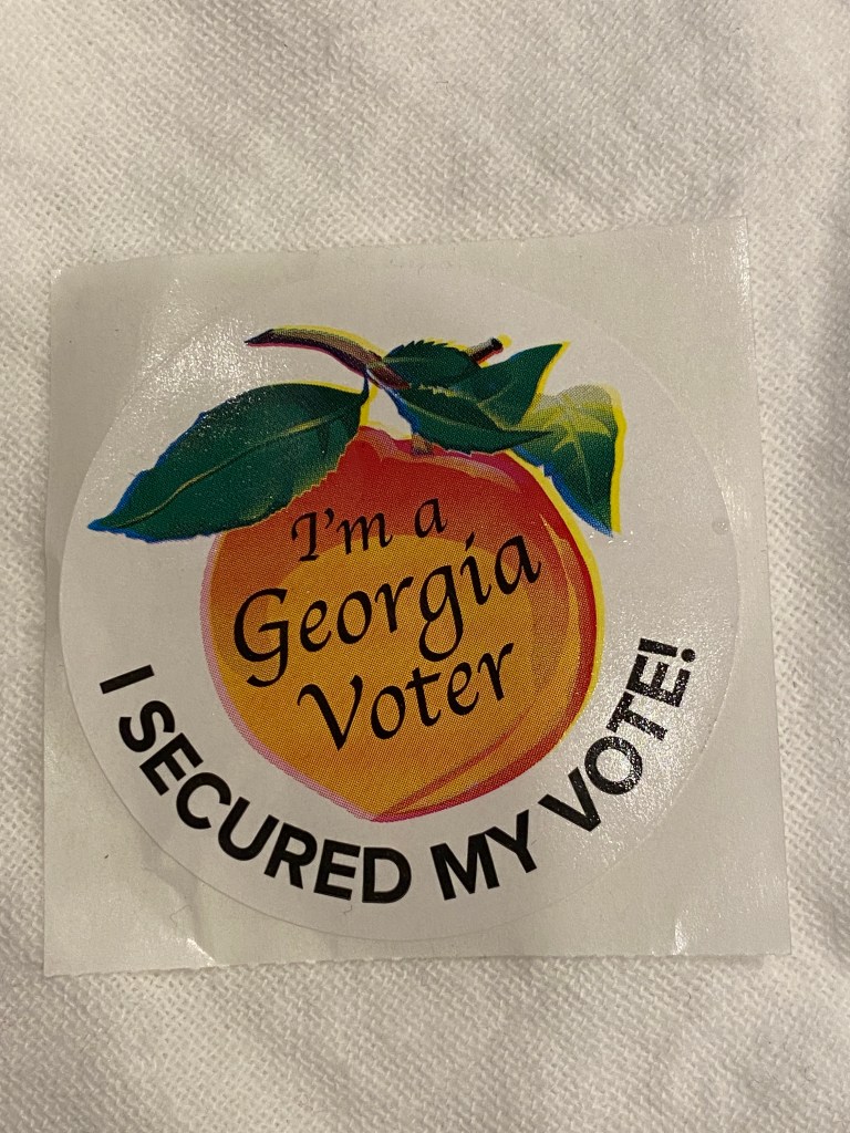 A photo showing an "I voted" sticker. 